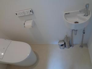 a bathroom with a toilet and a sink at SENKO TINY CAMP - Vacation STAY 29675v in Ueda