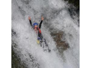 a person is riding a raft in a wave at Shimaonsen AYAMEYA Ryokan - Vacation STAY 20622v in Shima