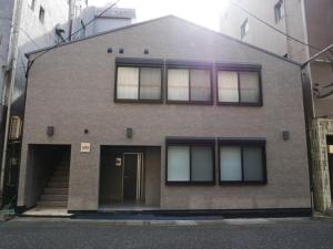 a large brick building with windows and a door at HOOD - Vacation STAY 19654v in Amami