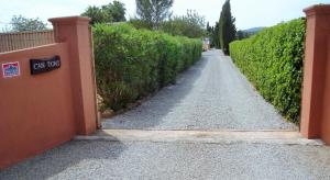 an entrance to a driveway with a sign that says can not at Moderne Finca mit sehr großem Grundstück und Privatpool in Sant Joan de Labritja