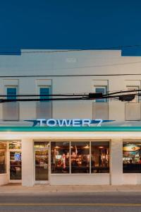a store with a sign on the side of a building at The Atlantic at The Tarrymore in Wrightsville Beach