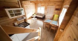 an overhead view of a living room in a log cabin at Appartements Piaskowy Raj in Gąski