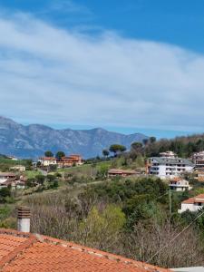 a view of a town with mountains in the background at Elìsim House in Caiazzo