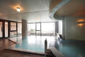 a swimming pool in a building with a pool at Hotel Taiko - Vacation STAY 21755v in Myoko