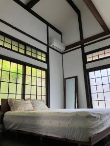 Llit o llits en una habitació de Kominkahaku Takenoko - Vacation STAY 45999v