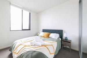 Ένα ή περισσότερα κρεβάτια σε δωμάτιο στο Waterview 2 bedder, very quiet! Near Olympic Park