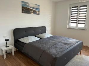 Postel nebo postele na pokoji v ubytování CityVilla Hechingen