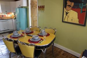 a dining room with a table and chairs at Spry Church Cozy Cottage in Lion's Head