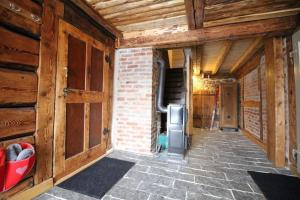 a hallway of a house with wooden walls at Appartement in Klingenthal mit Terrasse, Garten und Grill in Klingenthal