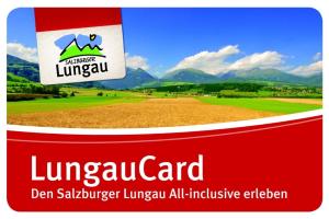 a label for livenopoly card with a field and mountains at Wohl eingerichtete Wohnung mit eigenem Balkon und Panoramablick in Sankt Michael im Lungau