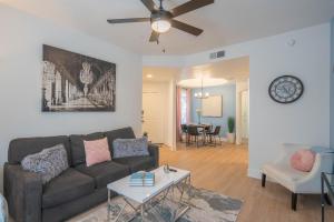 a living room with a couch and a table at King Bed Remodeled and Walkable Adjacent Kierland Golf in Scottsdale