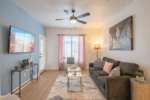 a living room with a couch and a ceiling fan at King Bed Remodeled and Walkable Adjacent Kierland Golf in Scottsdale