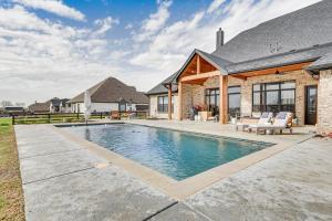 a swimming pool in the backyard of a house at Northlake Vacation Rental with Pool and Hot Tub Access in Northlake