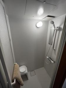 a small bathroom with a toilet and a shower at ALL SEASON CAMP - Vacation STAY 21071v in Biei