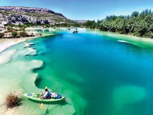 a person in a kayak in a body of water at Baymont by Wyndham Del Rio in Del Rio