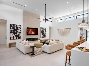 a living room with white furniture and a fireplace at LUXE - Tulum House - New Build - Heated Pool in Scottsdale