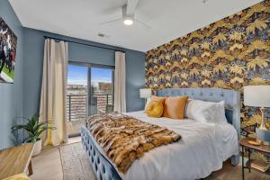 a bedroom with a large bed with a large window at Hyve - Whiskey Trails - Walk to Broadway in Nashville