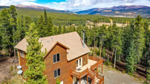 an aerial view of a house in the woods at Serene Mountain Cabin Nestled Amongst the Pines - Alpenhaus in Fairplay