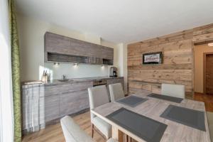 a dining room with a table and chairs at Ferienwohnung für 4 Personen ca 54 qm in Sölden, Tirol Skigebiet Sölden in Sölden