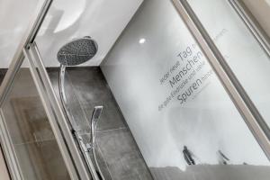 a bathroom with a shower with a glass door at Ferienwohnung für 4 Personen ca 54 qm in Sölden, Tirol Skigebiet Sölden in Sölden