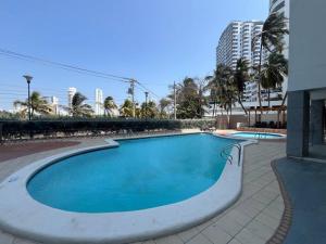 a swimming pool in the middle of a building at Amazing penthouse with stunning views & pool in Cartagena de Indias