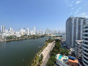 a view of a city with a river and buildings at Amazing penthouse with stunning views & pool in Cartagena de Indias