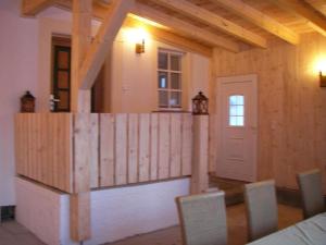 a room with a wooden fence in a house at Ferienhaus "Lena" in Presseck