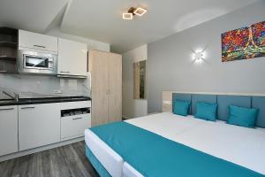 Η κουζίνα ή μικρή κουζίνα στο City-Hotel Zuffenhausen - Apartments +23 φωτογραφίες