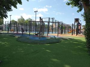 a playground in a park with a monkey at Les sables du midi in Valras-Plage