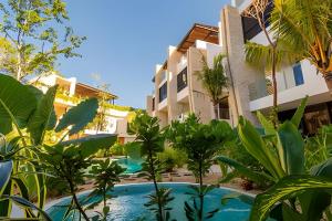 a view of the resort from the garden at Condo Moots 101 with private pool & rooftop yoga in Tulum