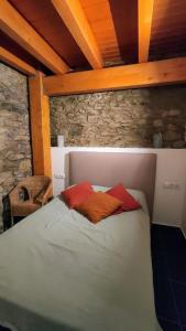 מיטה או מיטות בחדר ב-Cal cavalé