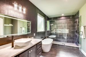 a bathroom with a sink and a toilet and a shower at Fire Pit and Grill Lakeside Gun Barrel City Home! in Gun Barrel City +21 photos