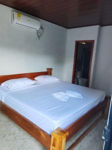 A bed or beds in a room at Finca Campestre La Flor