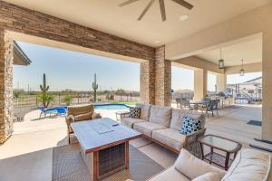 a living room with a couch and a table at Luxurious Desert Oasis Fireplace and Private Pool! in Apache Junction