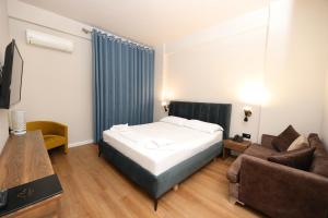 TV a/nebo společenská místnost v ubytování HOTEL LIBERTAS