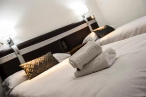 Voodi või voodid majutusasutuse HOSTAL LAS PALOMAS toas
