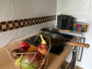 a bowl of fruit on a counter in a kitchen at Tolle Ferienwohnung in Vorderthiersee mit Grill, Garten und Terrasse in Thiersee