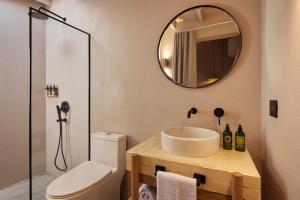 a bathroom with a sink and a mirror at ANTIPODA HOTEL Boutique in Medellín