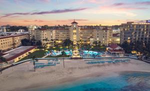 an aerial view of a resort with a beach and buildings at British Colonial Nassau in Nassau