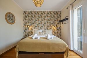 Postel nebo postele na pokoji v ubytování Casas do Salao by Homie