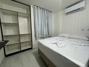 Ένα ή περισσότερα κρεβάτια σε δωμάτιο στο Flat a 400 metros da praia!, ótima localização.