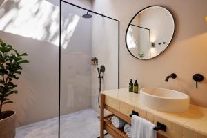 a bathroom with a sink and a shower at Antipoda Hotel Boutique in Medellín