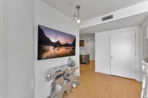 a living room with a large painting on the wall at 3 Lux large apartment heart of SM in Los Angeles
