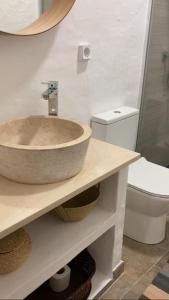 a bathroom with a sink and a toilet at Casa do Monte - Esperança in Esperança