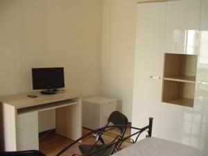 a room with a desk with a computer on it at Nonna Bruna in Matera