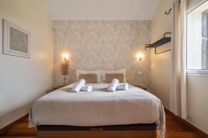 Postel nebo postele na pokoji v ubytování Casas do Salao by Homie