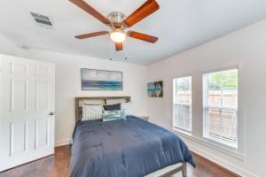 a bedroom with a ceiling fan and a bed at Lovely Waco Retreat with Yard and Patio 2 Mi to Dtwn! in Waco