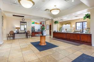 a lobby of a fast food restaurant with a counter at Quality Inn Tysons Corner in Tysons Corner