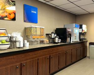 a counter with a coffee maker on top of it at Comfort Inn Falls Church - Tysons Corner in Falls Church