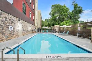 a swimming pool in front of a building at Home2 Suites By Hilton Asheville Biltmore Village in Asheville